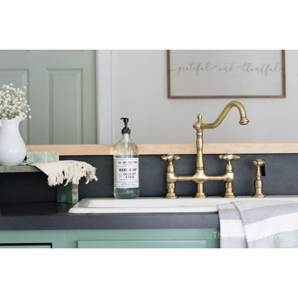 Robinet de cuisine Kingston Brass Heritage Bridge avec douchette en laiton